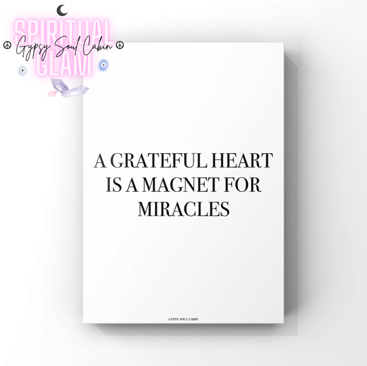 Black & white poster print with motivational quote 'A grateful heart is a magnet for miracles' on a white background.