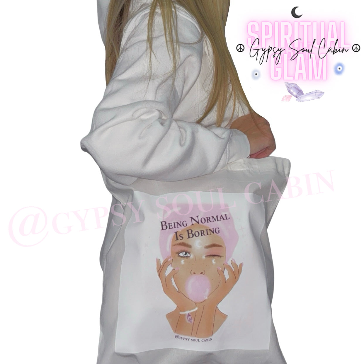 White canvas tote bag featuring an graphic illustration of a girl blowing bubblegum with the quote Being Normal Is Boring paired with a white Gypsy Soul Cabin hoodie.