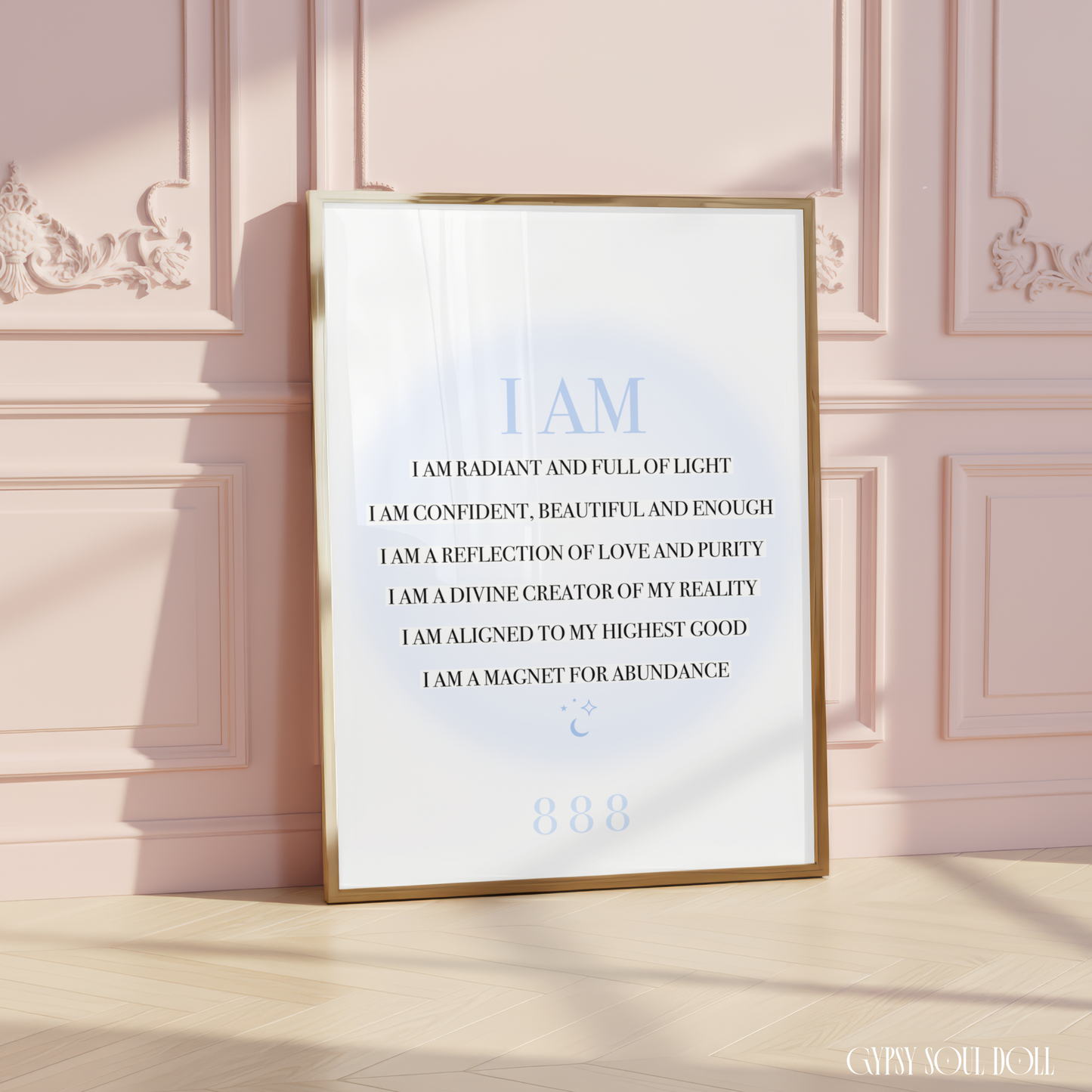 A4 spiritual typography print resting on a white surface, displaying a list of black I AM manifestation affirmations over a pastel blue aura gradient glow with an 888 angel number.