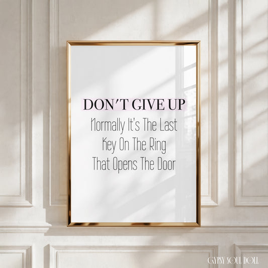 Minimalist A4 black and white typography wall art print featuring the inspirational text Don't give up Normally it's the last key on the ring Which opens the door.