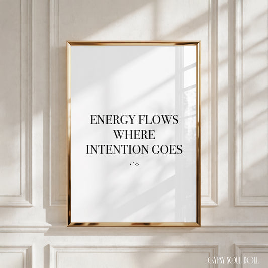 Minimalist A4 black and white typography wall art print featuring the spiritual manifestation quote Energy Flows Where Intention Goes with small star sparkles.