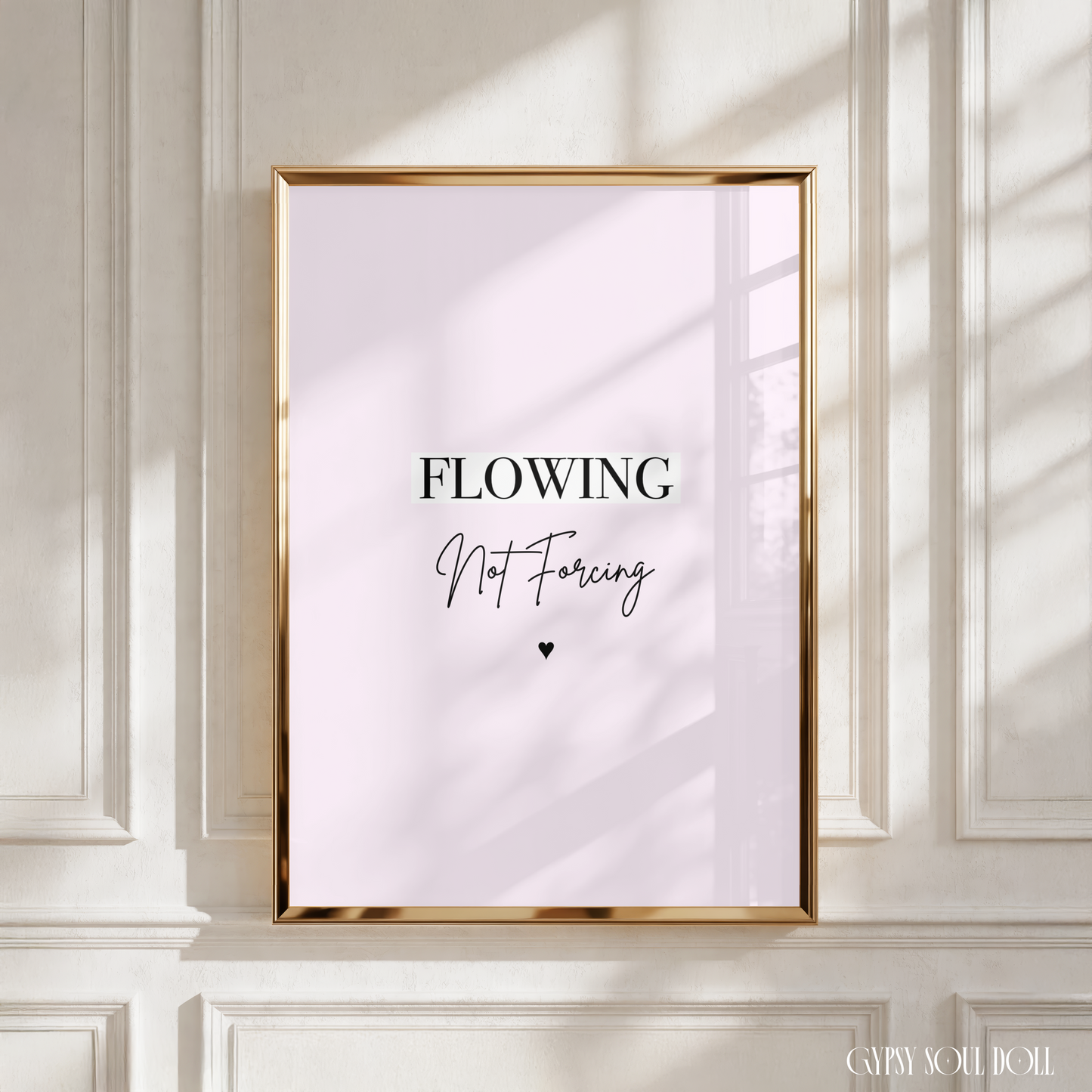 Minimalist pink wall print featuring crisp block lettering reading Flowing and delicate handwriting script reading Not Forcing above a small black heart icon.