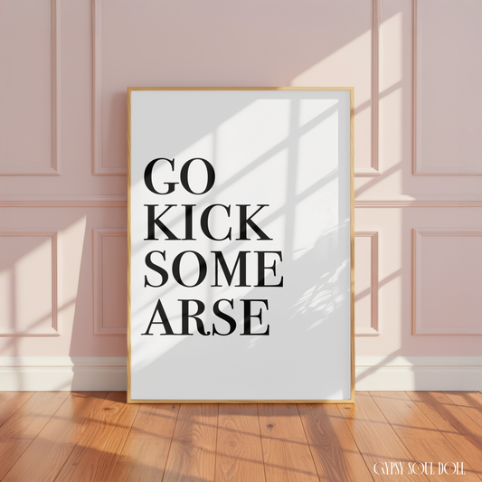 Alt text
Minimalist black and white manifestation affirmation typography print reading Go Kick
Some Arse in a large oak frame leaning against a panelled pink wall.
