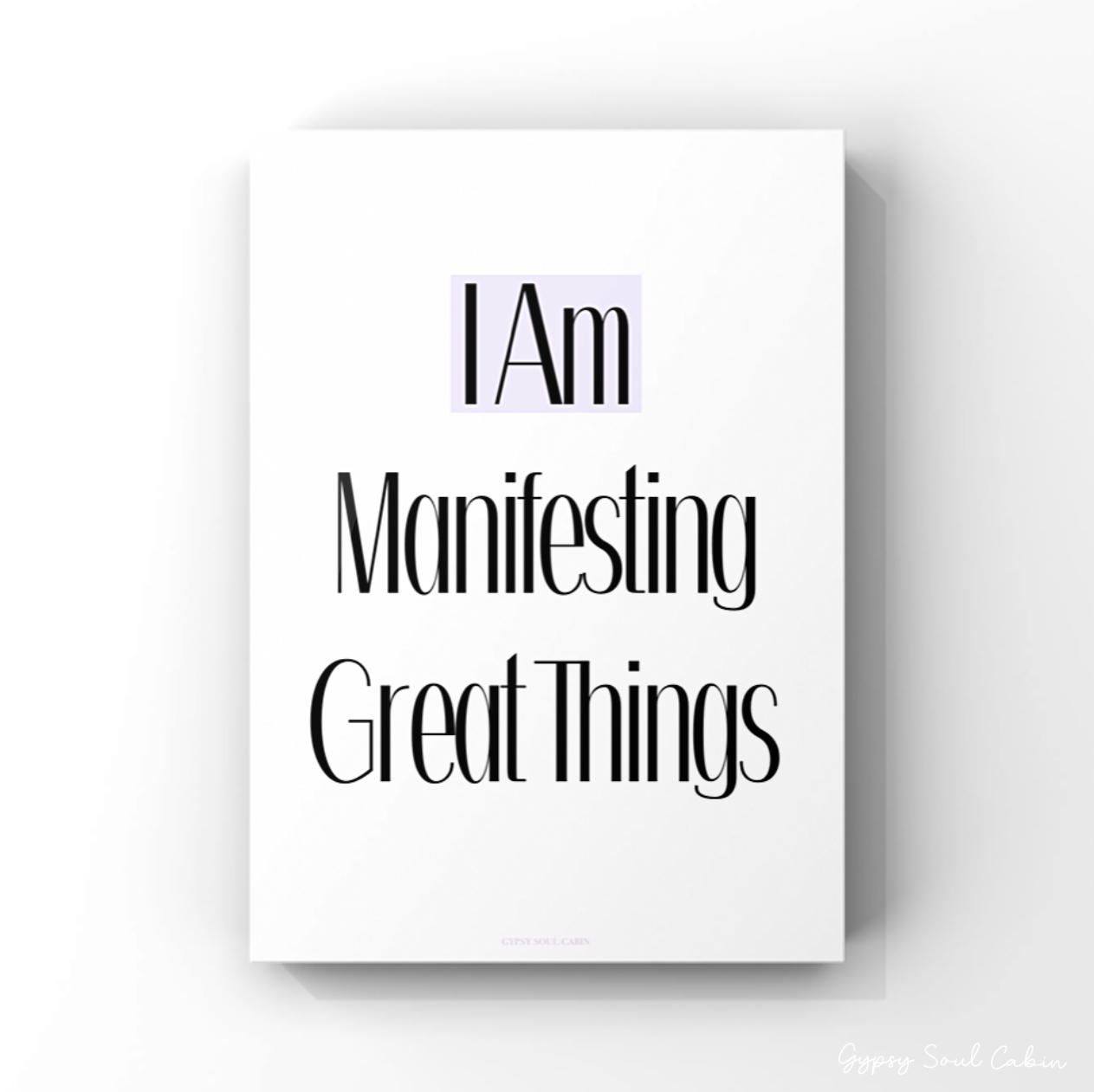 Minimalist A4 manifestation wall art print displaying bold black typography text reading I Am Manifesting Great Things centered on a clean white background.