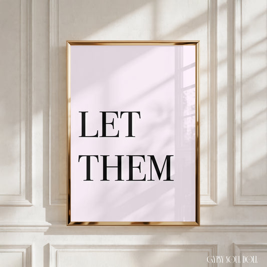High-impact minimalist pink art print reading "Let Them" in a bold black serif font.