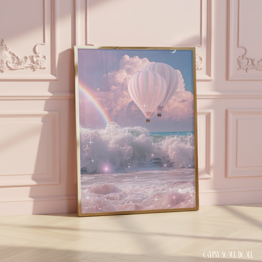 Framed artwork of a hot air balloon over waves and rainbow on a wall.