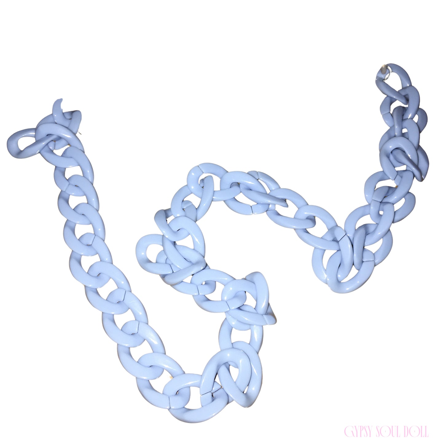 A chunky light blue chain glasses lanyard with oversized interlocking links, arranged in a loose spiral on a plain white background.