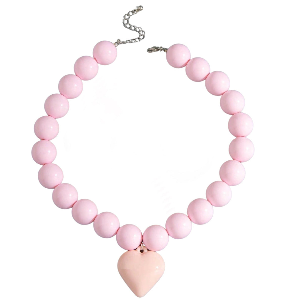 Studio product shot of the Gypsy Soul Doll pink chunky bubblegum resin bead necklace with a large matching pastel pink puffy heart pendant, showing its silver lobster clasp and adjustable metal chain extender against a plain white background.