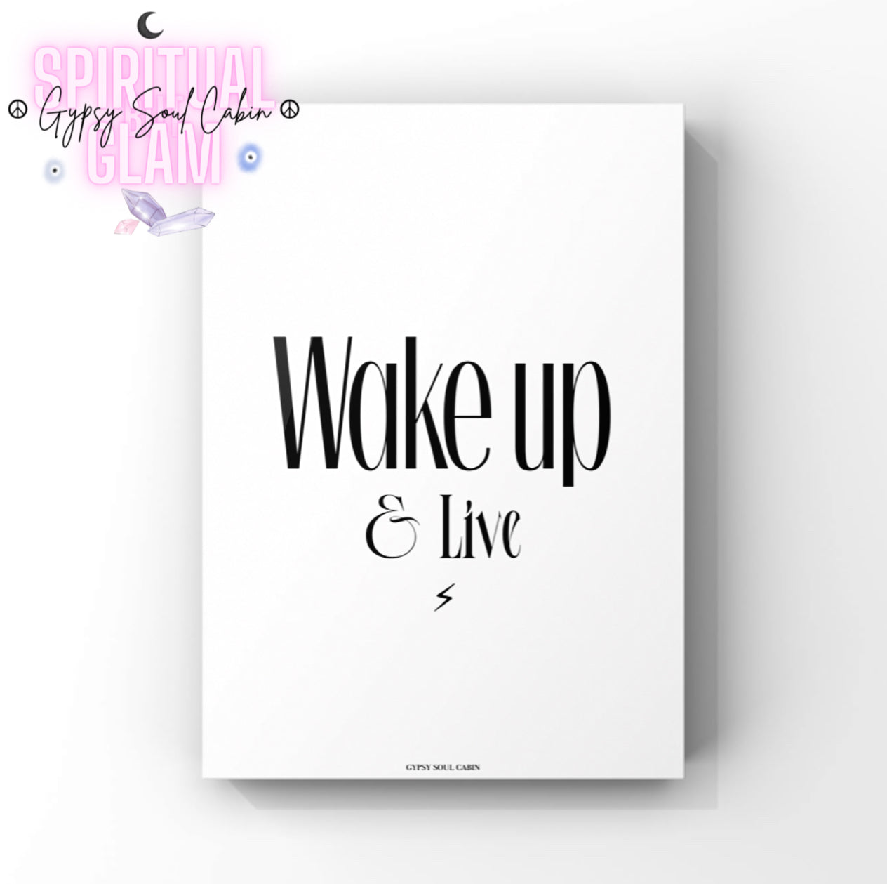 Elegant A4 motivation print displaying the phrase Wake up & Live in sharp black lettering with a tiny centred lightning bolt graphic at the bottom.