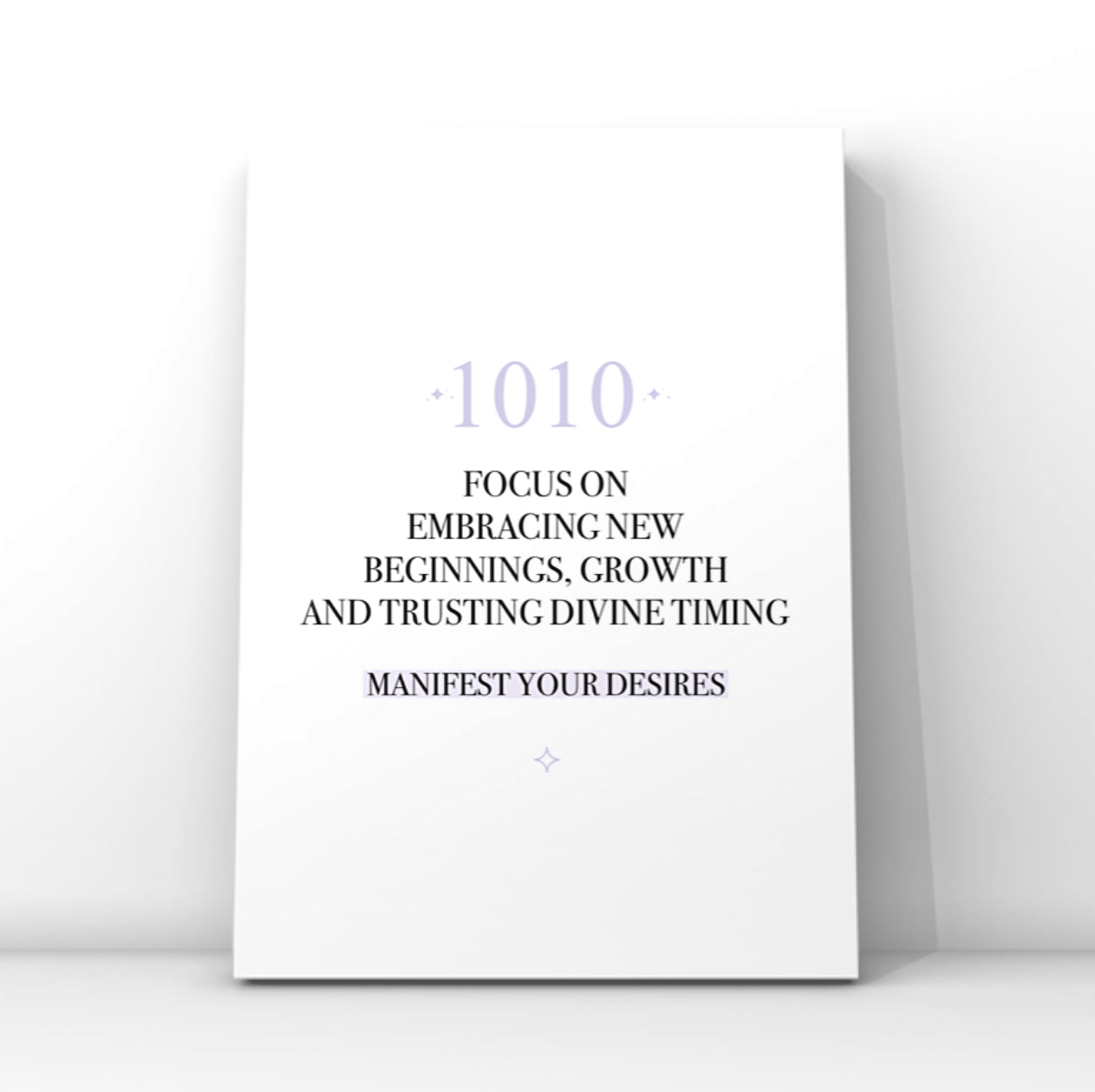 Minimalist typography print featuring a soft purple 1010 angel number and a pastel purple background highlight behind the words Manifest Your Desires.