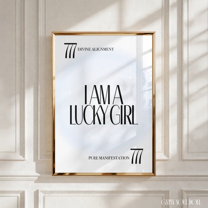 A4 poster print featuring "I Am A Lucky Girl" in high-end bold typography over an icy-blue radial aura gradient background with 777 angel numbers and divine alignment taglines by Gypsy Soul Doll.