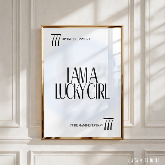 A4 poster print featuring "I Am A Lucky Girl" in high-end bold typography over an icy-blue radial aura gradient background with 777 angel numbers and divine alignment taglines by Gypsy Soul Doll.