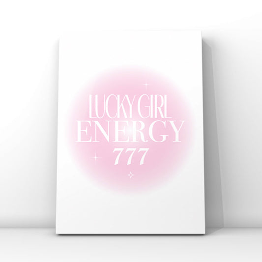 A4 poster print featuring "Lucky Girl Energy" and "+ 777" in clean white editorial typography over a soft pink radial aura gradient background with mini sparkles by Gypsy Soul Doll.