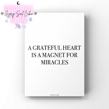Black & white poster print with motivational quote 'A grateful heart is a magnet for miracles' on a white background.