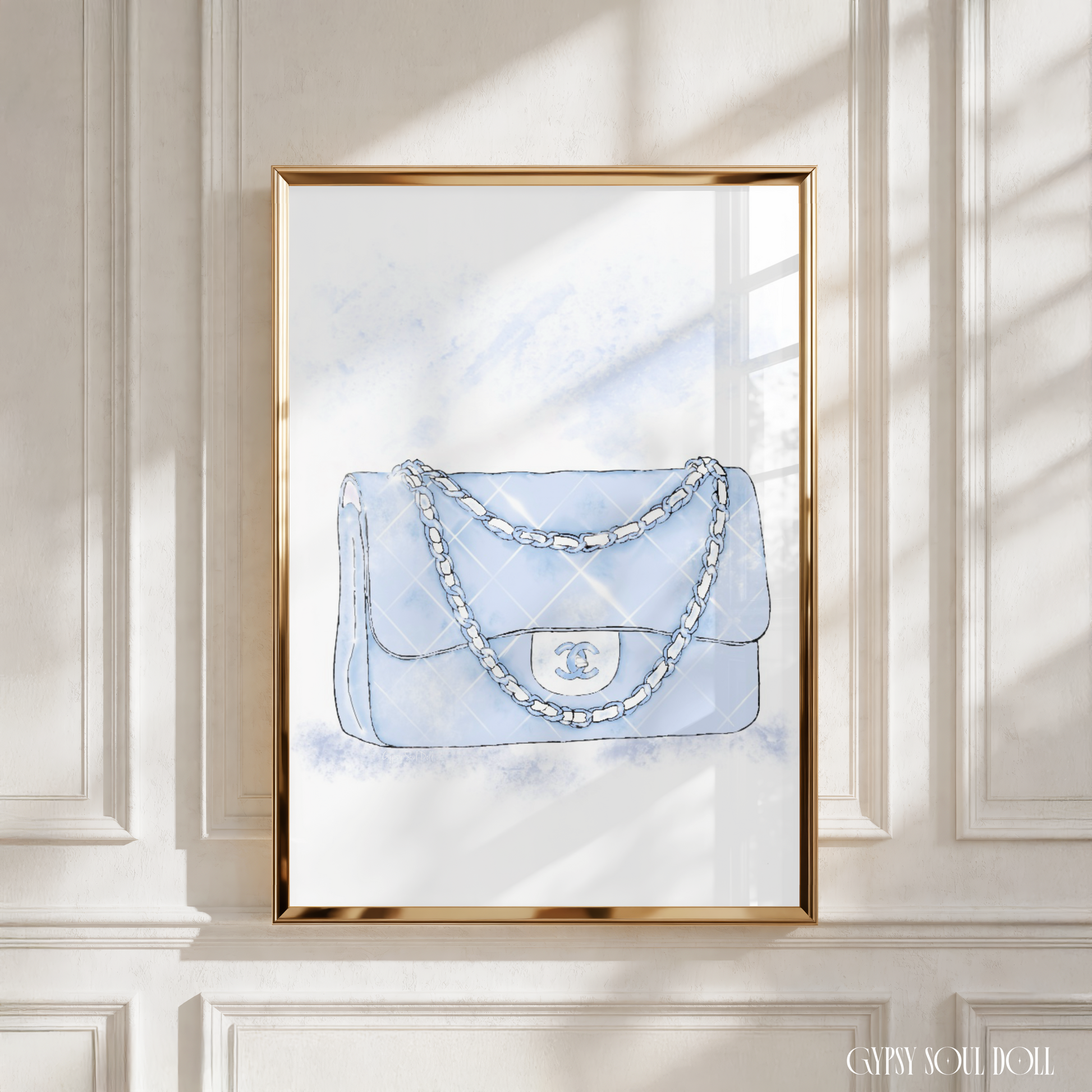 Light blue Chanel handbag with chain detail on a watercolour background.