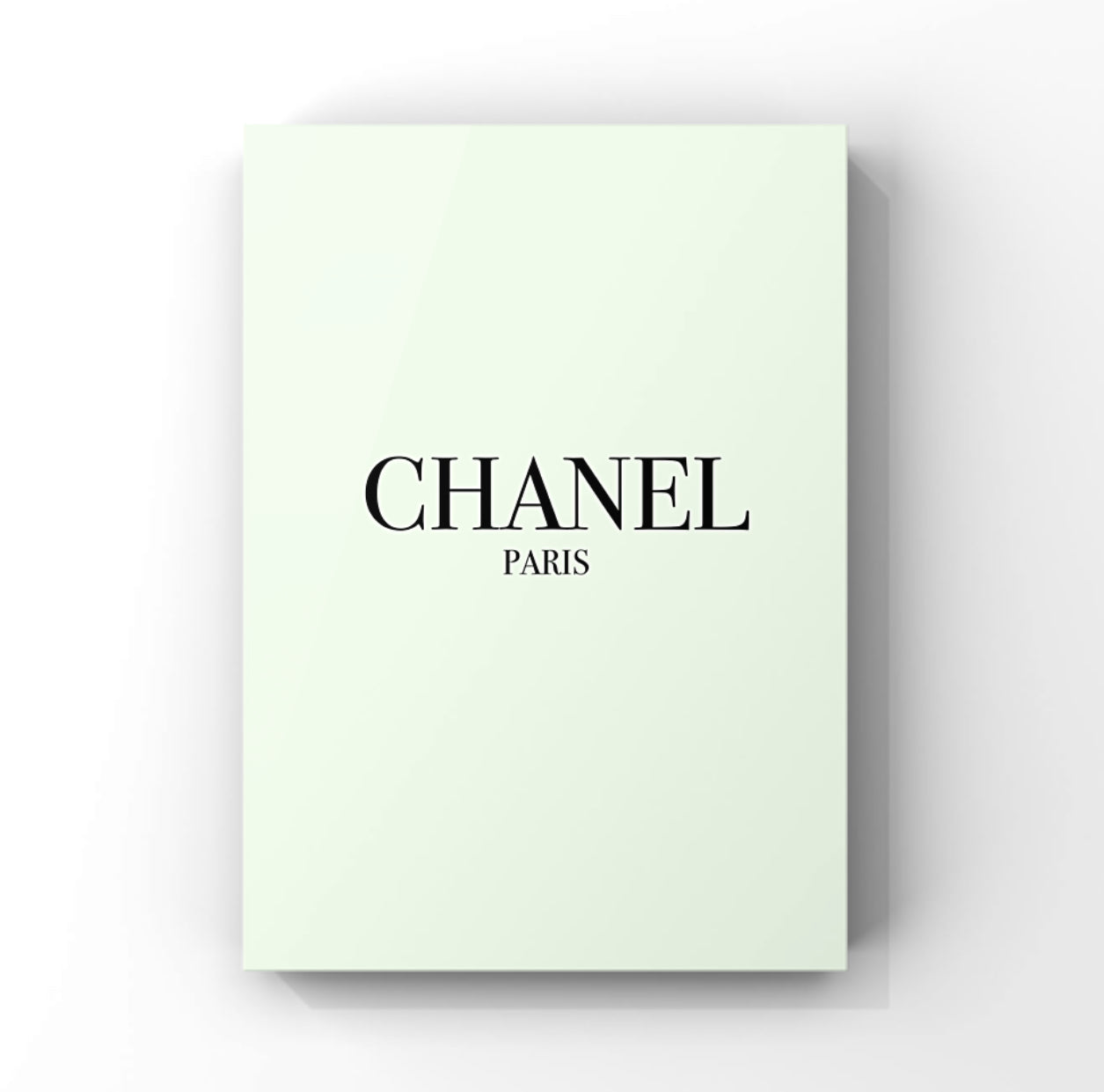 Elegant Chanel minimalist fashion art print in A4 size and pastel green colour with black writing.