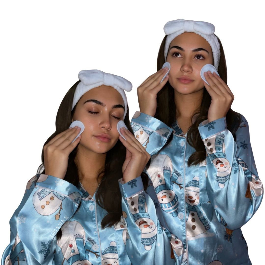 A women wearing light blue satin pyjamas with a snowman print, blue headbands, and blue towel cleansing pads, photographed against a plain white background by Gypsy Soul Dolight-blue 