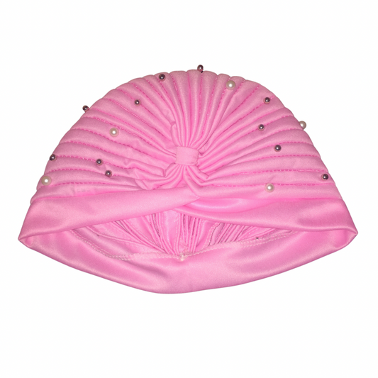 Close-up of a pink satin bohemian gypsy head wrap adorned with pearl beads, showcasing its gathered, ruched design and decorative details.