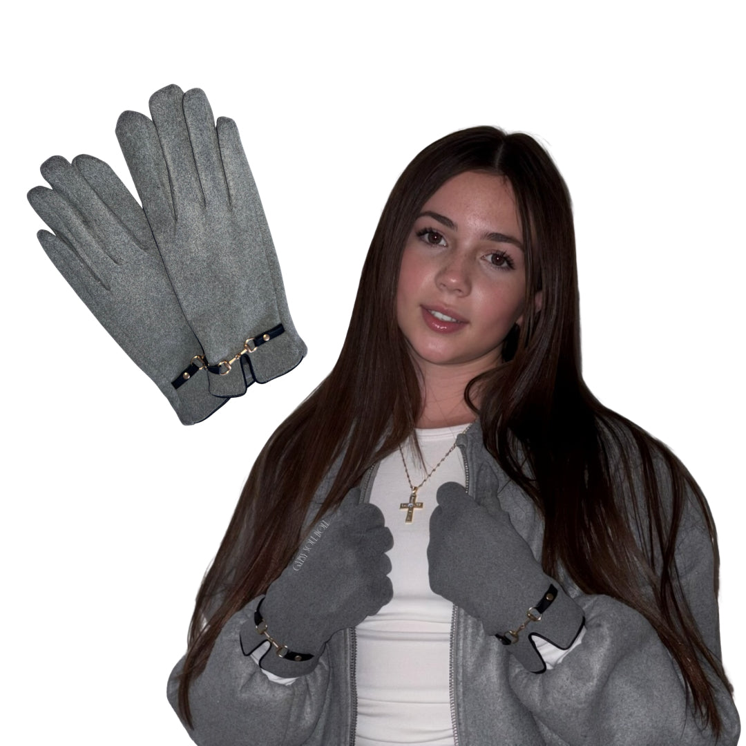 A studio portrait overlay layout featuring a model showcasing a matching high-fashion winter accessories collection against a plain white background, wearing a cosy grey bomber jacket paired with premium soft-touch grey winter gloves detailed with gold-buckled wrist straps, while an isolated flat-lay graphic of the grey velvet gloves floats in the top left corner.