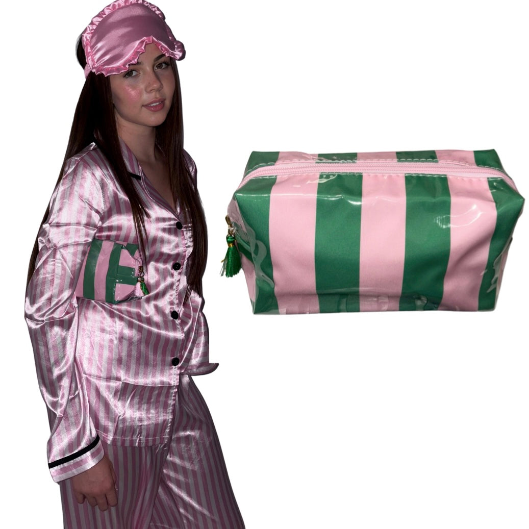A model wearing a pink candy stripe luxury satin pyjama set with a matching ruffled sleep mask while holding a pink and emerald green striped cosmetics pouch, alongside a close-up product shot of the green and pink striped makeup bag with a tassel detail by Gypsy Soul Doll.