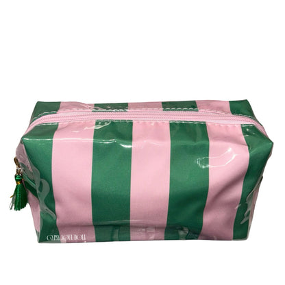 A close-up studio shot against a white background featuring a luxury pink and emerald green candy stripe cosmetics bag with a pink top zipper and a decorative green fringe tassel on the zip pull by Gypsy Soul Doll.