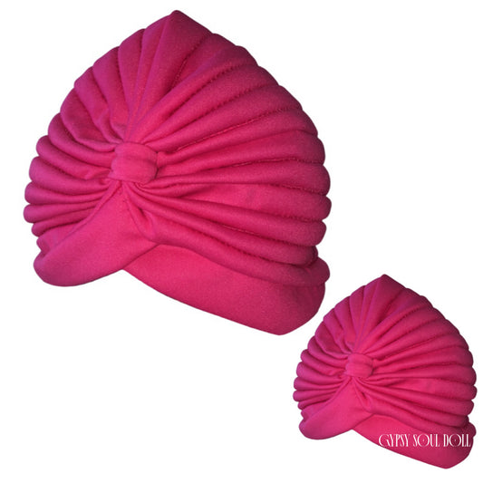 Two bright pink pleated turban-style bohemian headwraps on a plain white background, with a small 'GYPSY SOUL DOLL' logo near the lower right headwrap.