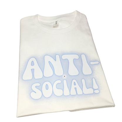 Front view of a folded premium white cotton crew-neck t-shirt featuring a custom blue fuzzy Y2K airbrush graphic print reading Anti-Social.
