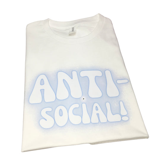 Front view of a folded premium white cotton crew-neck t-shirt featuring a custom blue fuzzy Y2K airbrush graphic print reading Anti-Social.