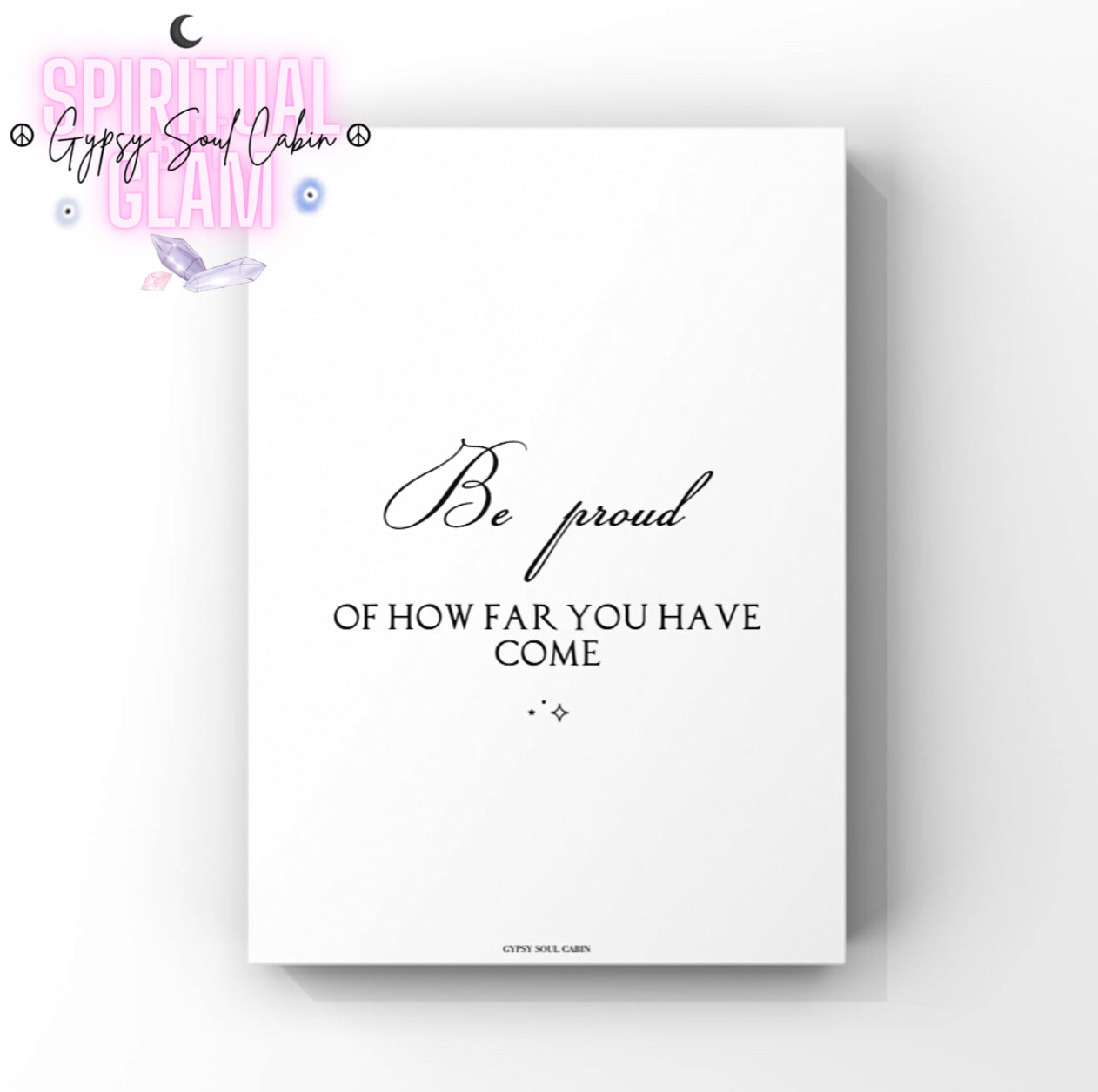 Elegant monochrome self-care wall art combining a fluid cursive script text for Be proud with two tiny, centred celestial sparkle details below.