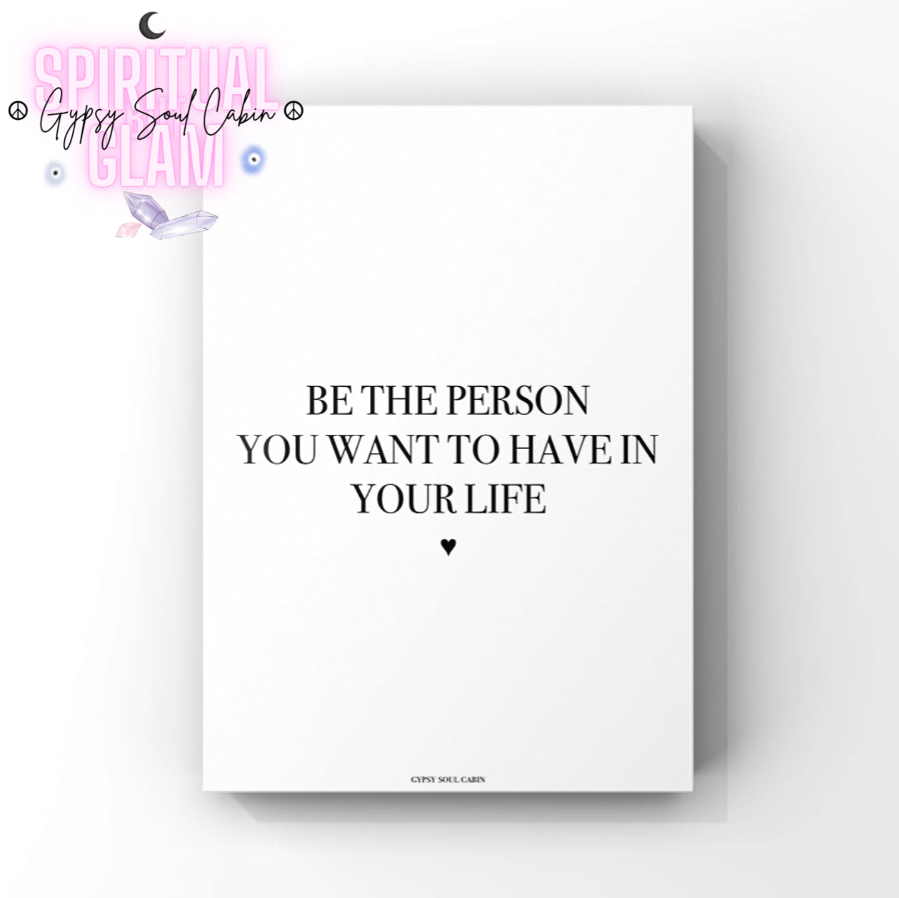 Clean minimalist typography print featuring the inspirational self-love quote "Be The Person You Want To Have In Your Life," with a small black heart icon underneath.