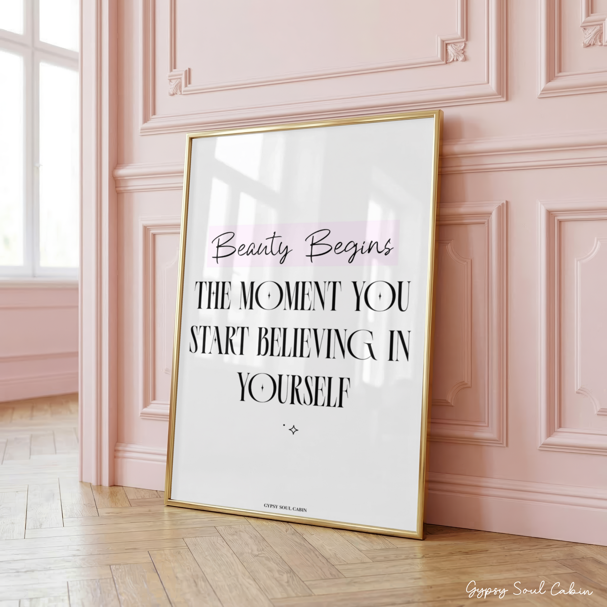 Mindset affirmation quote wall art print featuring the text Beauty Begins highlighted in a pink block above bold black lettering that reads The Moment You Start Believing In Yourself.