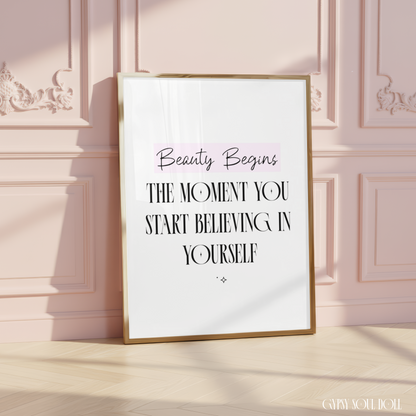 Inspirational A4 typography print reading Beauty Begins The Moment You Start Believing In Yourself featuring a soft pink highlight banner on a clean white background.