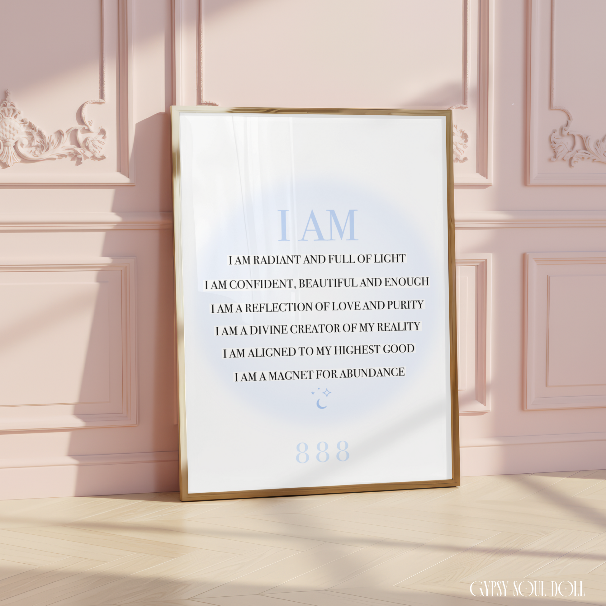 A4 spiritual typography print resting on a white surface, displaying a list of black I AM manifestation affirmations over a pastel blue aura gradient glow with an 888 angel number.