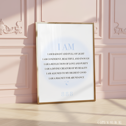 A4 spiritual typography print resting on a white surface, displaying a list of black I AM manifestation affirmations over a pastel blue aura gradient glow with an 888 angel number.