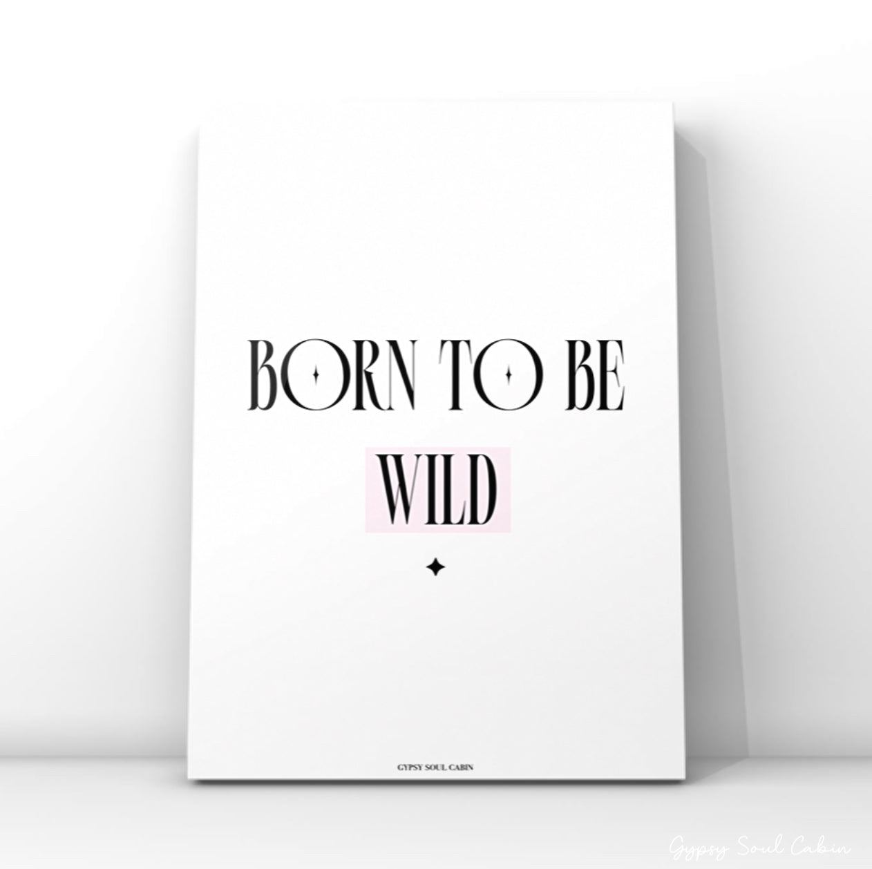 Modern feminine bedroom typography poster displaying the words Born To Be Wild with a soft pink highlight behind the word Wild.
