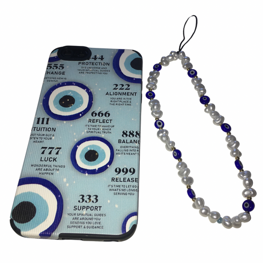 Flat lay view of the Gypsy Soul Doll Cosmic Guard tech set, featuring a blue evil eye phone case printed with angel number texts next to a matching beaded phone strap made of irregular white pearls and blue evil eye beads.