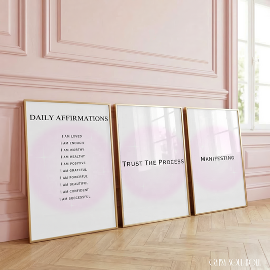Set of three minimalist typography prints featuring a glowing pastel pink aura background with daily manifestation affirmations and spiritual quotes.
