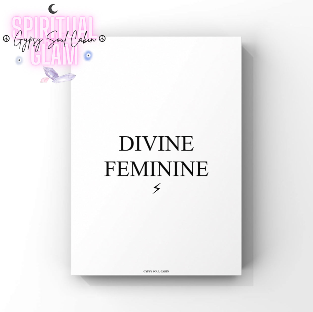 Minimalist white wall art print displaying bold black typography that reads Divine Feminine with a clean black lightning bolt symbol below the text by Gypsy Soul Cabin.