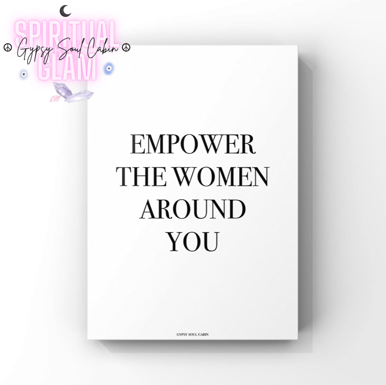 Empowering wall art with a motivational quote on a white background, featuring bold black text that reads empower the women around you.