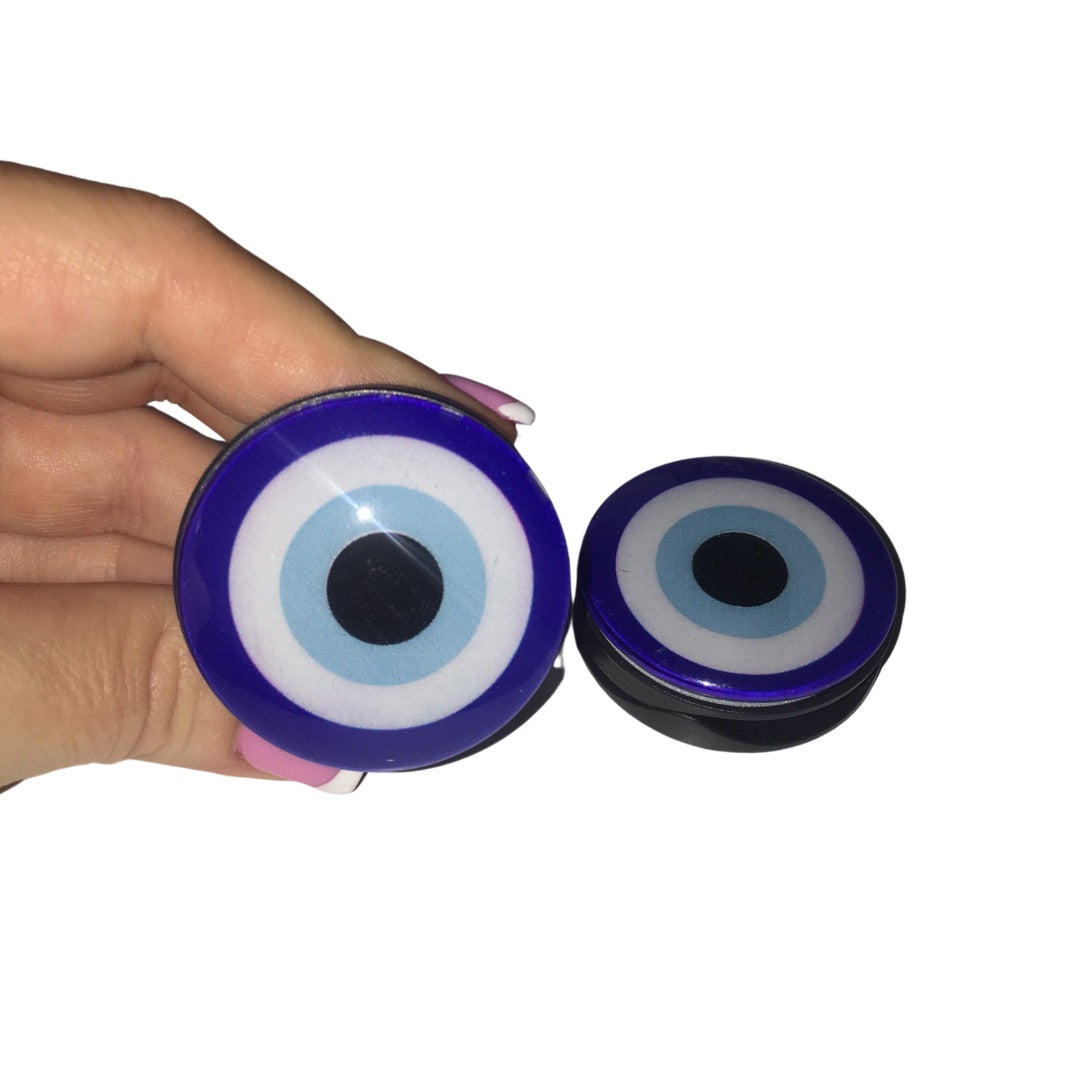 Two glossy deep cobalt blue protective evil eye adhesive phone grips displaying the black collapsible stand layout side-by-side.