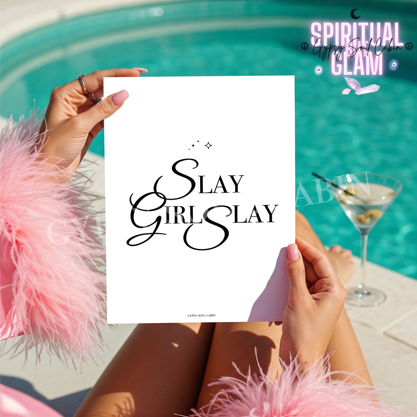 A4 black and white typography print featuring Slay Girl Slay design, held by a woman in pink feathers by a poolside.