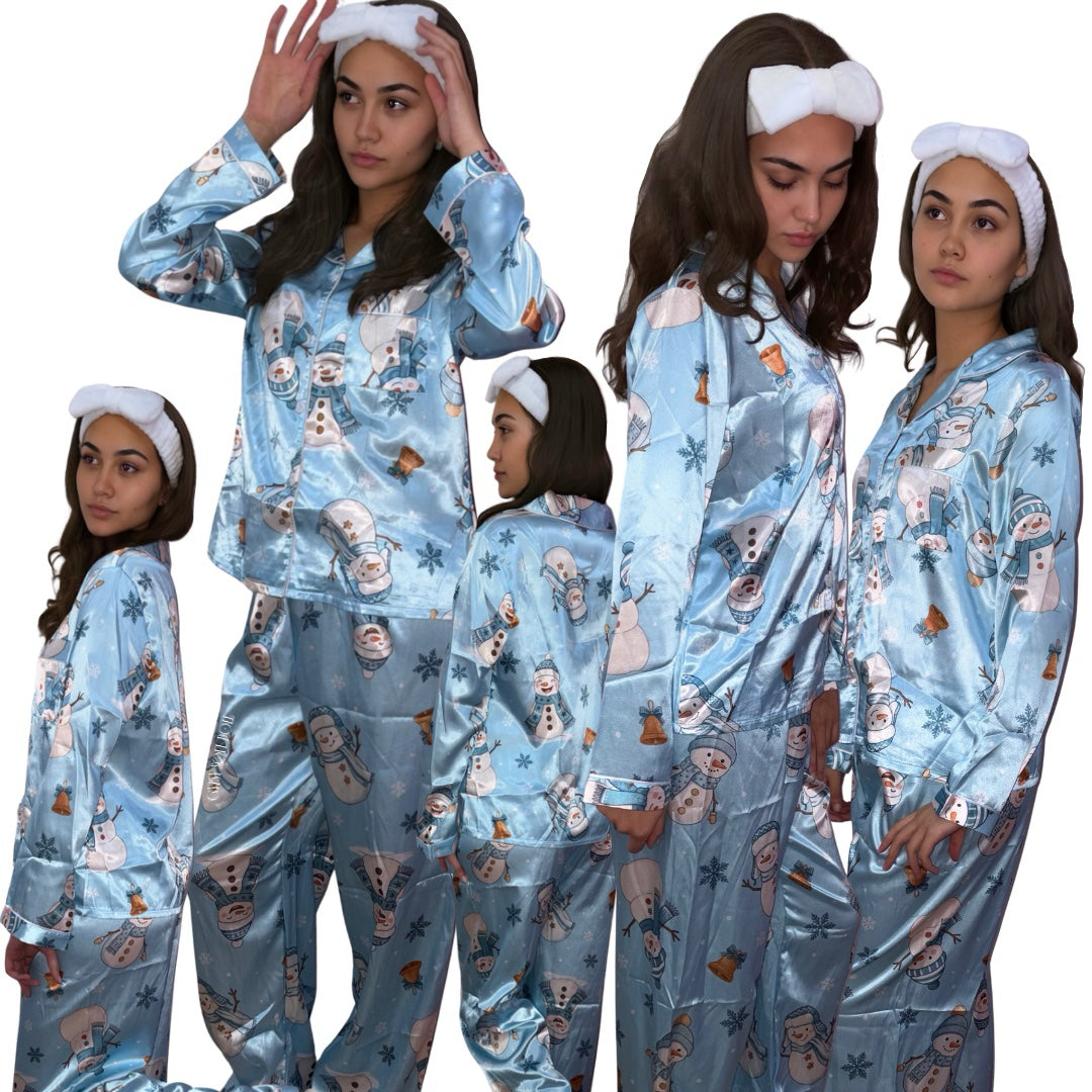 Multi-pose studio layout featuring a model showcasing the loose elegant fit and festive winter print of a holiday pyjama set.