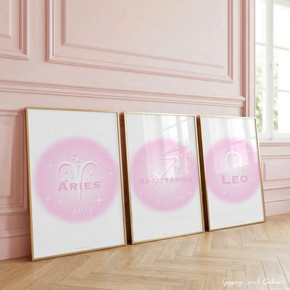 Set of three high-vibe astrology aura gradient prints in soft pink and white featuring the Fire zodiac signs Aries, Sagittarius, and Leo with cosmic star illustrations.