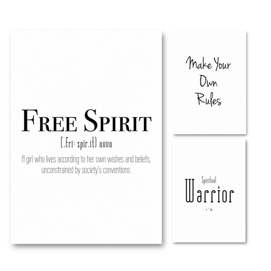 A set of three minimalist white A4 typography prints featuring a Free Spirit dictionary definition poster, Make Your Own Rules in a handwritten script, and Spiritual Warrior with tiny sparkles.
