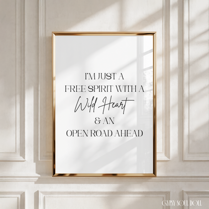 Minimalist black and white A4 fashion print featuring the quote I'm Just A Free Spirit With A Wild Heart & An Open Road Ahead in compressed serif typography and cursive script.