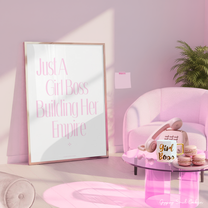 Pink room with 'Just a Girl Boss Building Her Empire' poster, pink chair, and 'Girl Boss' coffee mug.