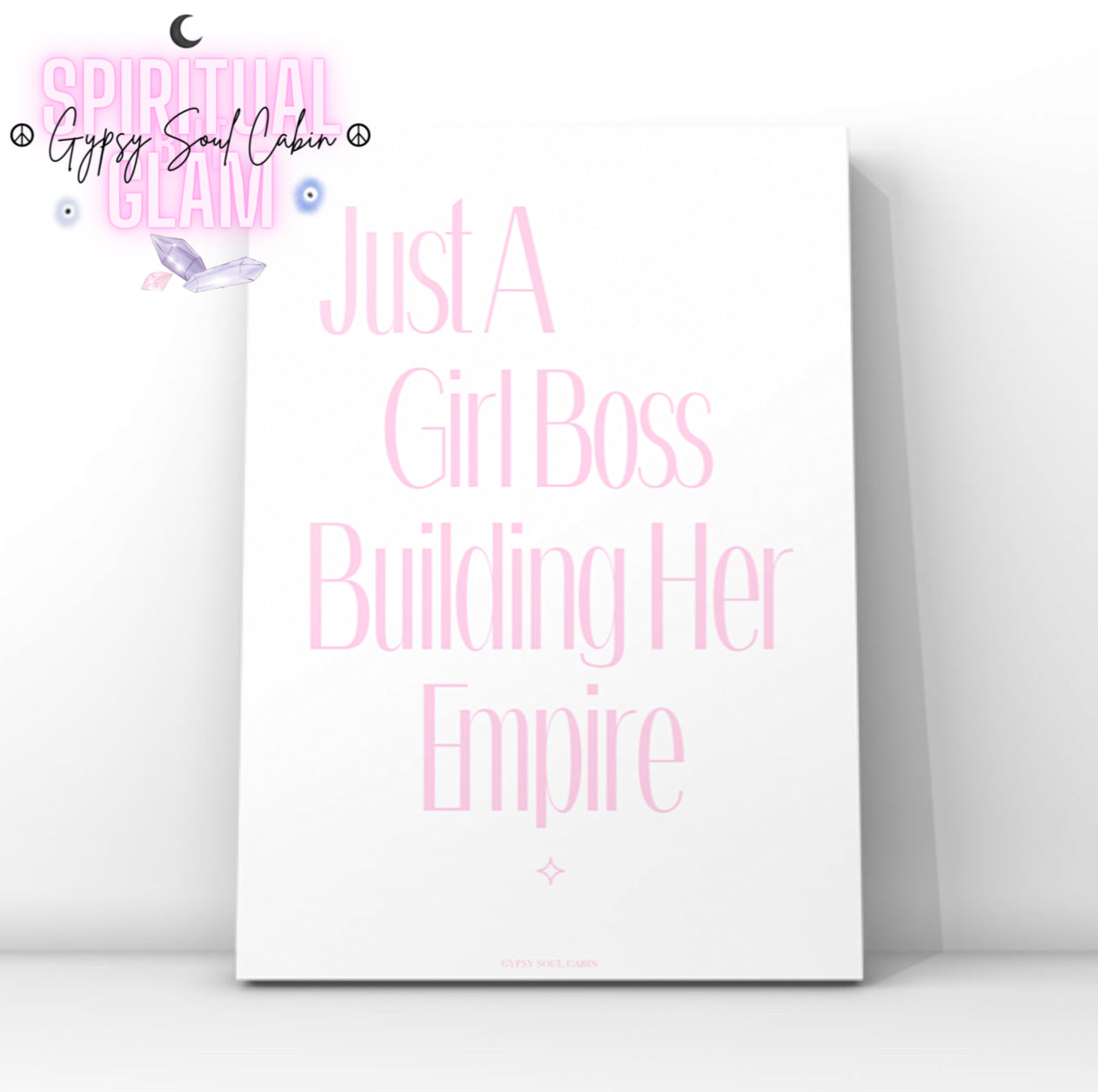 Minimalist pink typography wall art featuring the motivational quote Just A Girl Boss Building Her Empire with a subtle star sparkle accent at the bottom.