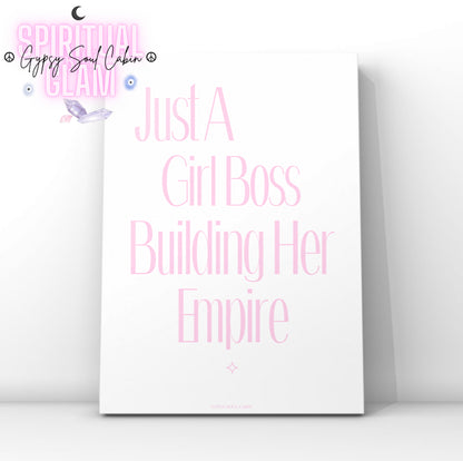 Minimalist pink typography wall art featuring the motivational quote Just A Girl Boss Building Her Empire with a subtle star sparkle accent at the bottom.