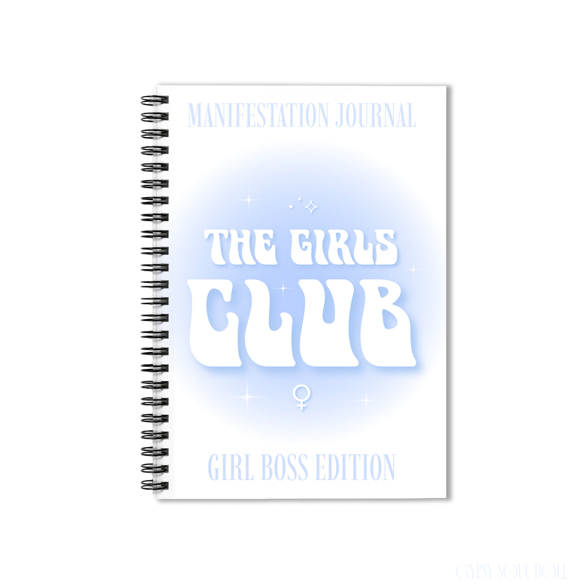 A white spiral-bound notebook with a black wire binding, featuring the text 'MANIFESTATION JOURNAL', 'THE GIRLS CLUB', and 'GIRL BOSS EDITION' in white and light blue on the cover by Gypsy Soul Doll.