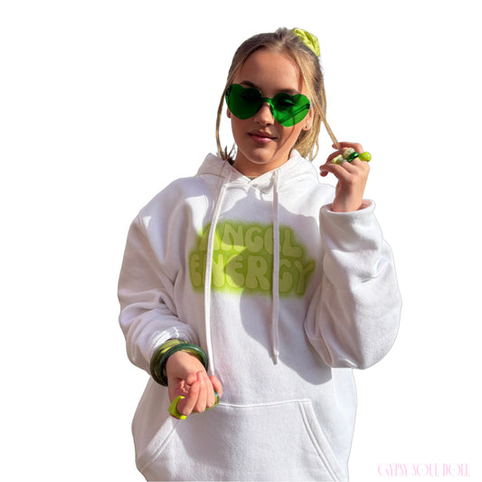 Model showcasing green heart-shaped glasses paired with matching green bangles, chunky rings, a hair scrunchie, and an Angel Energy hoodie by Gypsy Soul Doll.